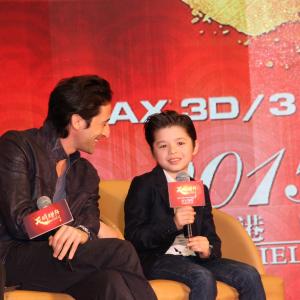 Adrien Brody is amused with Jozef Waites story in Beijing China at the Dragon Blade premiere February 2015