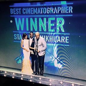 Screen Grab of Stanlee Ohikhuare receiving his Award for Best Cinematographer at the 2015 AMVCA
