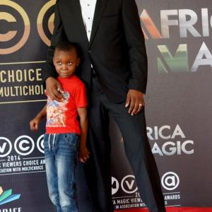 Stanlee Ohikhuare and his son David on the Red Carpet of the 2014 AMVCA