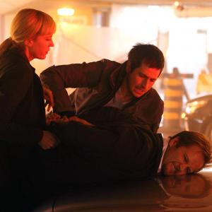 Still of Craig Anthony Olejnik and Lauren Lee Smith in The Listener (2009)