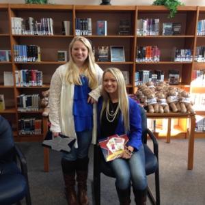 Kirsten and Kaitlyn read to kids on Scott Airforce base hosting the 'Bear Essentials' Event for LPE.
