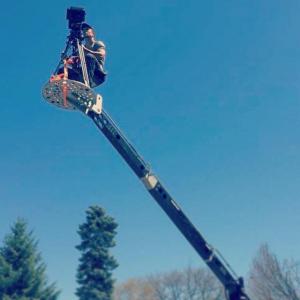 Director of Photography Russ De Jong operating a crane shot in ride-on mode with his crane.