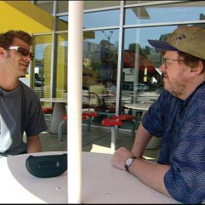 Still of Matt Stone and Michael Moore in Bowling for Columbine (2002)