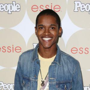 Octavius J. Johnson on carpet of People's Ones to Watch Party