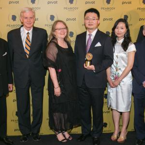 Leon Lee(C) poses with his award and guests at The 74th Annual Peabody Awards Ceremony at Cipriani Wall Street on May 31, 2015 in New York City.