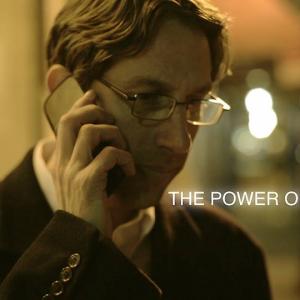 As Agent Hicks in the short film The Power Of Knowing, taking an important call.