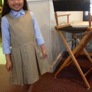 Raina Cheng in school uniform provided by wardrobe for an episode on Person of Interest. 2015