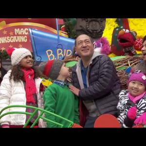 Raina Cheng & cast of a Sesame Street float performing on the Sesame Street float at the Macy's Thanksgiving Day Parade. 2014