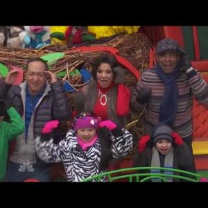 Raina Cheng & cast of Sesame Street performing on the Sesame Street float at the 88th Macy's Thanksgiving Day Parade. 2014