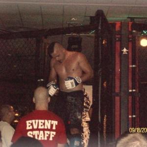 Troy Musil exciting the cage after his 2nd MMA fight. musil won the fight.