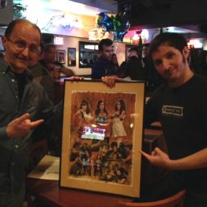 With film maker, Newt Wallen displaying some original poster art for his upcoming exploitation trailer extravaganza, 