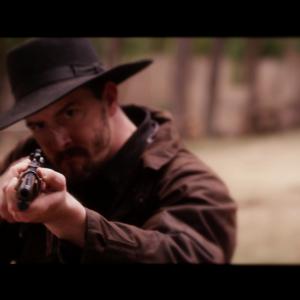 Brian Spangler as Wade in Dead Husband in a Western Town