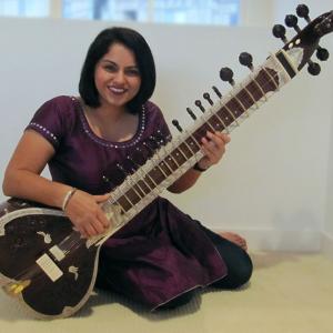 Playing the sitar.