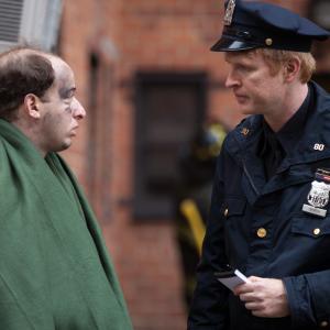 A cop interviews a victim of a fire on the indie film Manhattan Nocturne