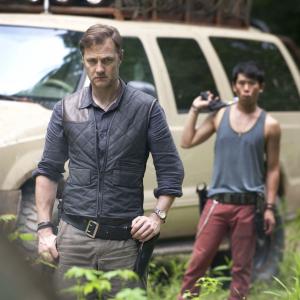 Still of David Morrissey and Lawrence Kao in Vaikstantys numireliai (2010)
