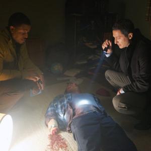 Still of Russell Hornsby and Sasha Roiz in Grimm 2011