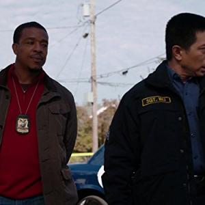 Still of Russell Hornsby and Reggie Lee in Grimm (2011)