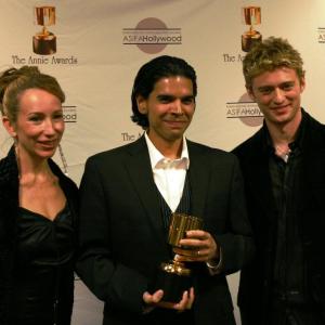 Presenters Jennifer Taylor Lawrence and Crispin Freeman, with Joby Otero (center), winner of best animated video game for Kung Fu Panda