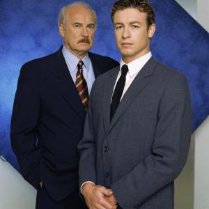 Still of Dabney Coleman and Simon Baker in The Guardian 2001