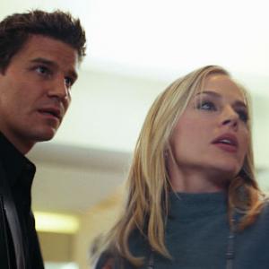 (L-R): Angel (David Boreanaz) encounters Darla (Julie Benz) in the flesh at populated shopping area. From the episode: 
