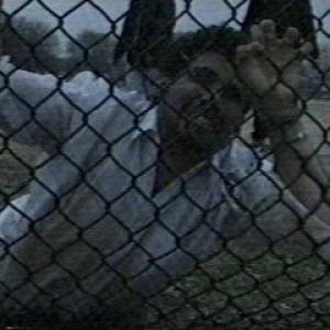 Cuffed to a fence