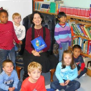2012 promotional school and book tour photo of Ford with school children in Alabama