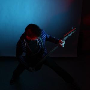 Michael Zovistoski photo shoot Playing bass guitar