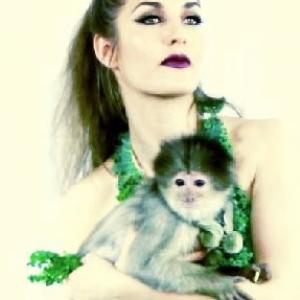 Justine Sophia on set with Zumi the Capuchin Monkey