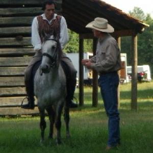 Ed as Head Wrangler giving riding instruction to Wes Studi in PBS We Shall Remain