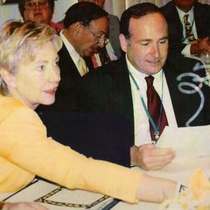 Hillary Clinton & Don Metzner. Hillary is preparing for her speech and Metzner is preparing for his introduction of her.