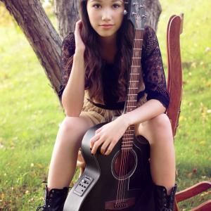 Jory Zechner posing with her first guitar Photoshoot for her EP