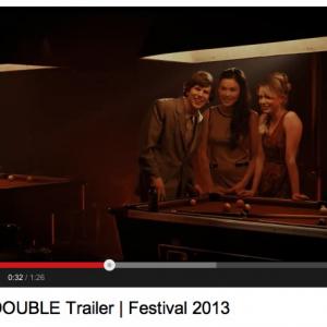 Screenshot from The Double (2013) trailer of Jesse Eisenberg and Jemma Moore.