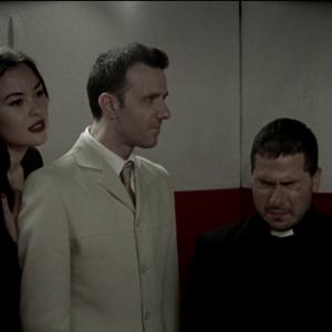 Screenshot of characters Demon Angel and Priest in Free your mind  your ass will follow directed by Aadhar Gupta