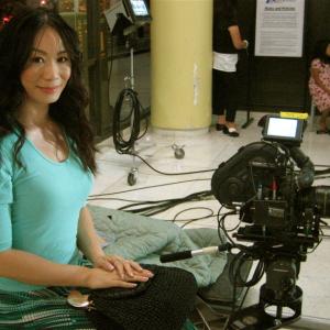 Chinese Daily News: Still Photograph of Linda Wang filming on set for the Irsih band 