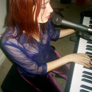 singing and playing her Roland 300SX