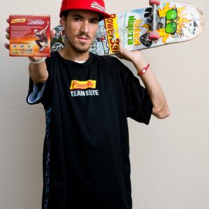 Photo of Ruben Najera holding up his Pro signature PowerBar Box cover which was sold in Target, Wal Mart, Ralphs, Vons, and Rite Aid stores worldwide.