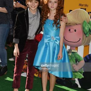 Actors Noah Schnapp L and Francesca Capaldi attend the premiere of 20th Century Foxs The Peanuts Movie at the Regency Village Theatre in Westwood California
