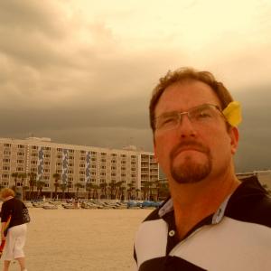 Contemplating the 60 mph wind on Clearwater beach usually the last to leave