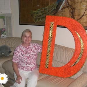Mona Deutsch Miller with her favorite prop the Big D from The Beating