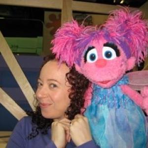 Ilyana Kadushin on the set of Sesame Street television with Abby.