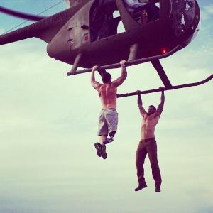 On set doing helicopter pullups