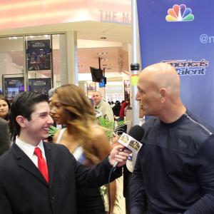 Neil A. Carousso (left) shares a laugh with comedian Howie Mandel on the red carpet