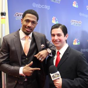 Nick Cannon left poses with Neil A Carousso on the red carpet