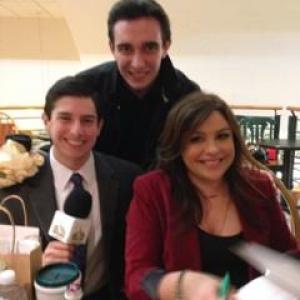 Neil A Carousso left interviews Rachael Ray and poses for picture with colleague Christian Ladigoski middle at Book Revue in Huntington NY