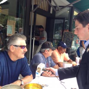Neil A Carousso right interviews Hall of Fame pitcher Rollie Fingers in Cooperstown NY