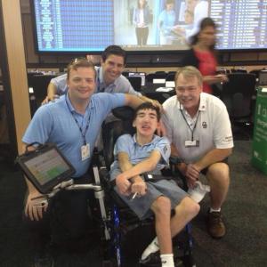 Neil A Carousso back poses for a picture with colleague Rich DeKorte left and inspiring young man and Golf Fanatic to the Bones Dave Finn middle and his father right at The Barclays 2014 PGA Tour event in Paramus NJ