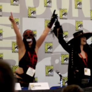 Jen right and Sylvia Soska left in their Enigma Arcana designed Undertaker and Kane cosplay at the SNE2 panel at SDCC 2014