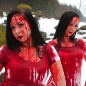 Sylvia (left) and her twin sister, Jen (right), on the set of their fourth Massive Blood Drive PSA.