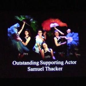 Screen announcing Samuels National Youth Awards win for Outstanding Supporting Actor in a Musical for his performance as Archie in 13 The Musical