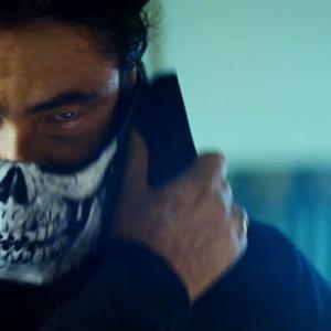 Benicio Del Toro, wearing the skull mask Clint Carney created for Oliver Stone's 